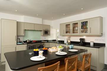 The kitchen has a large island/breakfast-bar as well as the breakfast-table.
