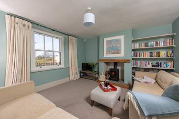 This is the tranquil snug which also has a wood-burning stove. This room links directly to the kitchen and the front hall.