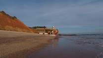The east Devon and Dorset Jurassic Coast is spectacular. This is Sidmouth. A lovely Regency seaside town - with a world famous Folk Festival each year. There is plenty of sand at low tide.