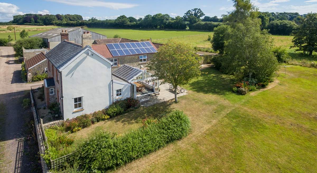 Wreath Farmhouse in its wonderful setting with extensive south-facing gardens and a garden-room.