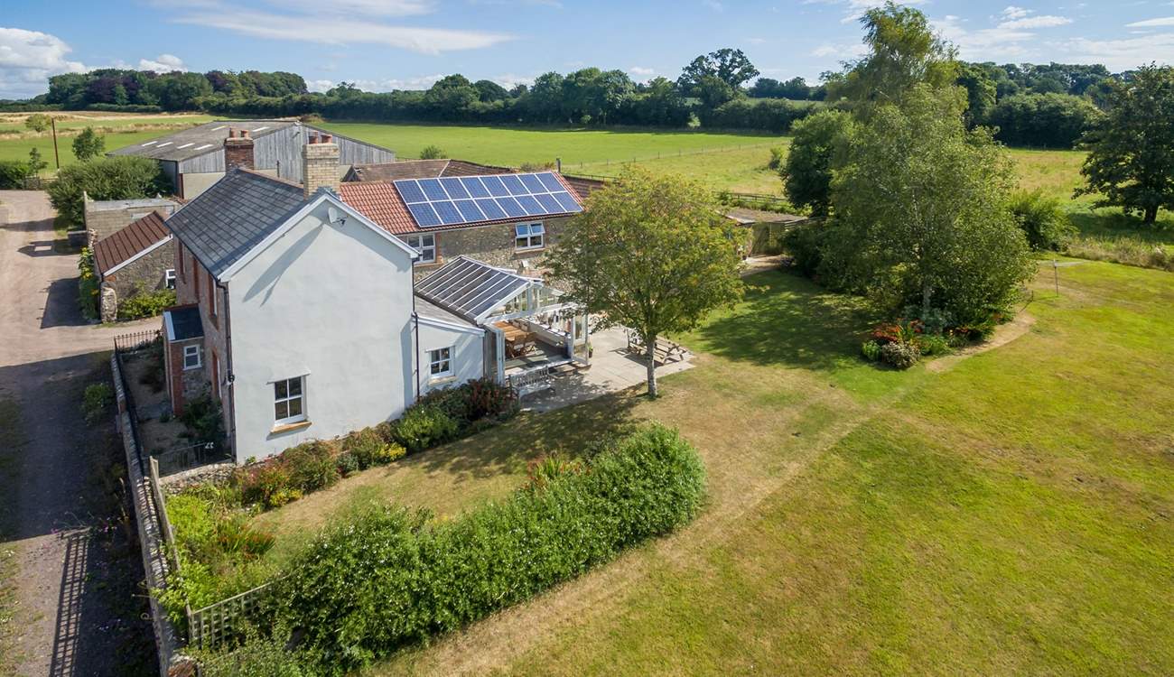 Wreath Farmhouse in its wonderful setting with extensive south-facing gardens and a garden-room.