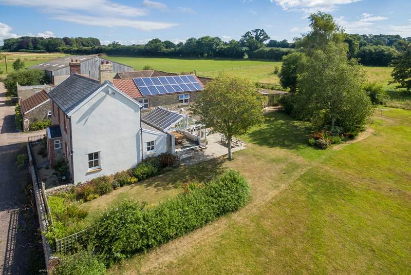 Wreath Farmhouse in its wonderful setting with extensive south-facing gardens and a garden-room.