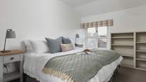 This peaceful room can be accessed from the main landing or via a dressing-room through to the 'main' bedroom. Its views are over the gardens and valley beyond. A second window looks out into the farmyard. It can be set as a king-size bed or twins.