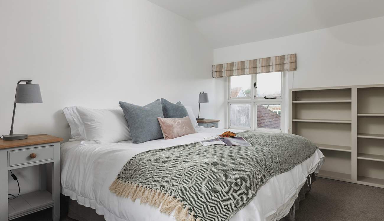 This peaceful room can be accessed from the main landing or via a dressing-room through to the 'main' bedroom. Its views are over the gardens and valley beyond. A second window looks out into the farmyard. It can be set as a king-size bed or twins.