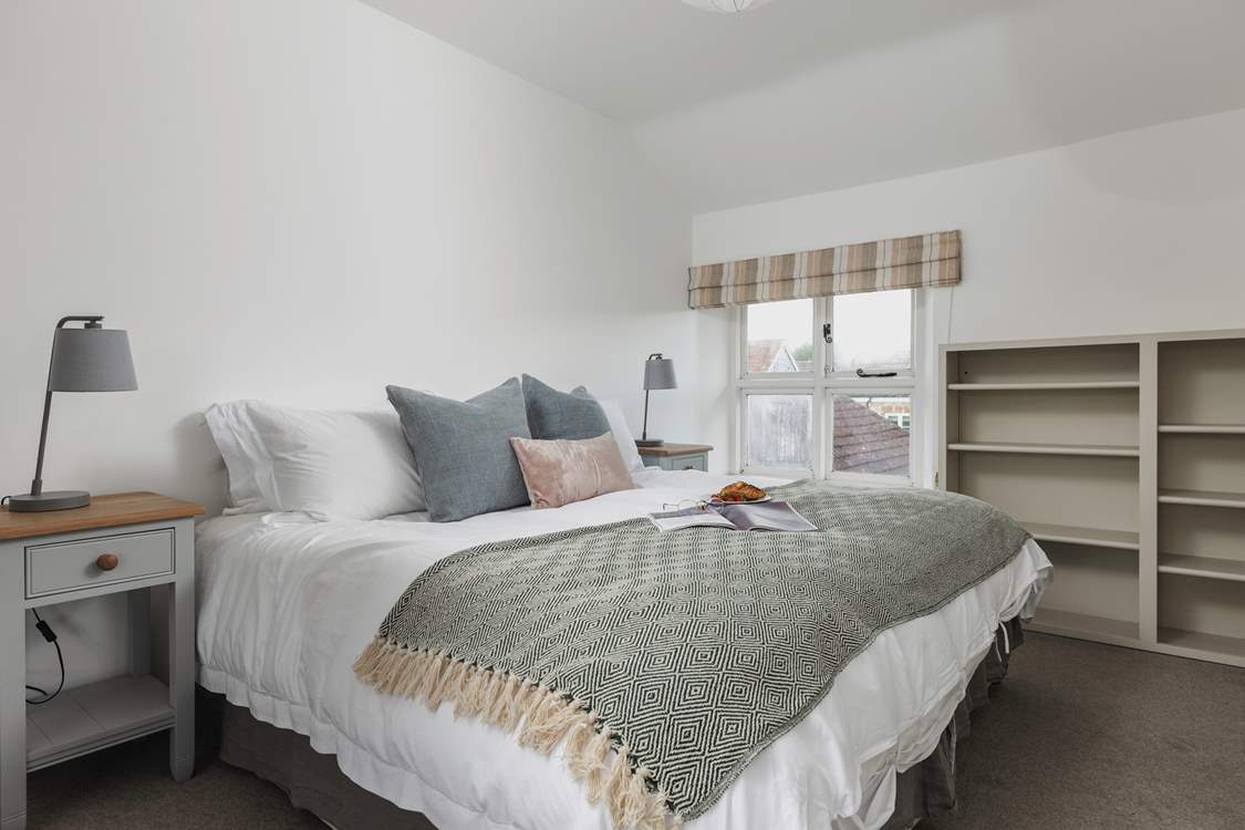 This peaceful room can be accessed from the main landing or via a dressing-room through to the 'main' bedroom. Its views are over the gardens and valley beyond. A second window looks out into the farmyard. It can be set as a king-size bed or twins.