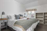 This peaceful room can be accessed from the main landing or via a dressing-room through to the 'main' bedroom. Its views are over the gardens and valley beyond. A second window looks out into the farmyard. It can be set as a king-size bed or twins.
