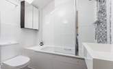 This bedroom has an en suite bath and fitted shower. - Thumbnail Image