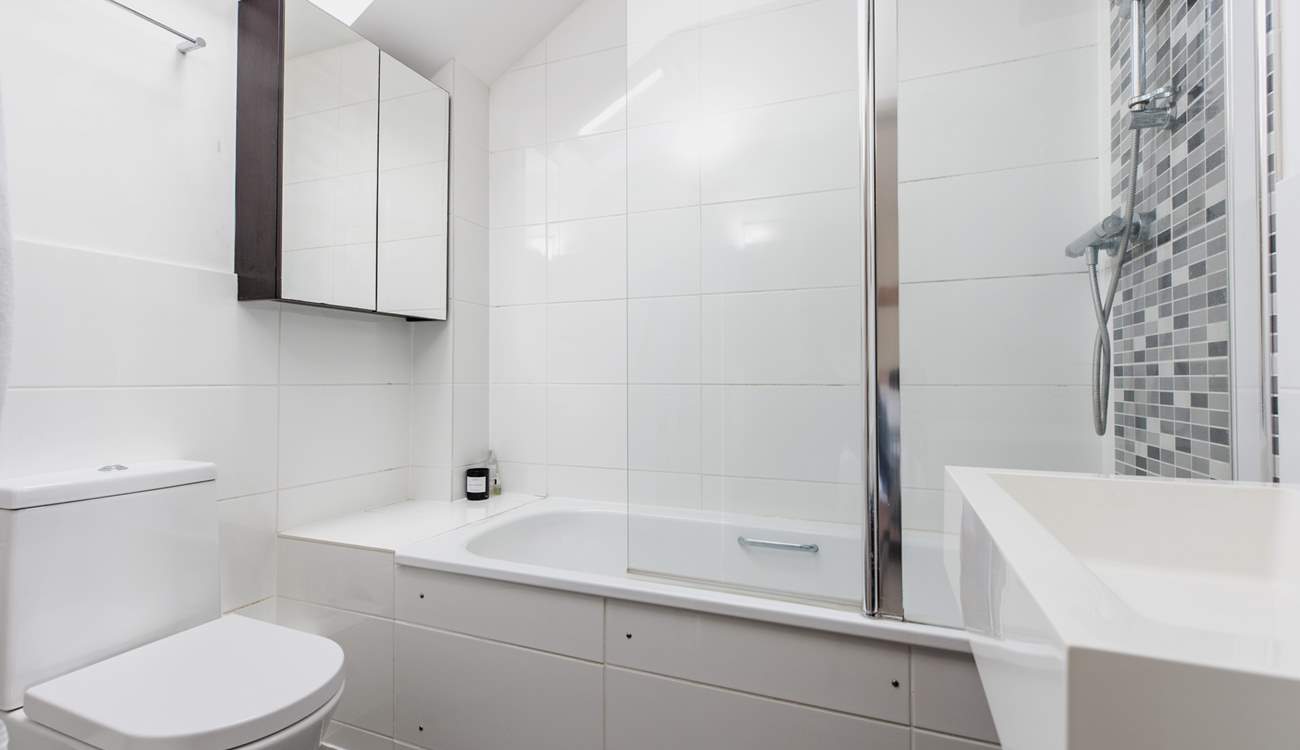 This bedroom has an en suite bath and fitted shower.