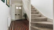 The traditional front entrance hall. The stairs lead to three of the four bedrooms.