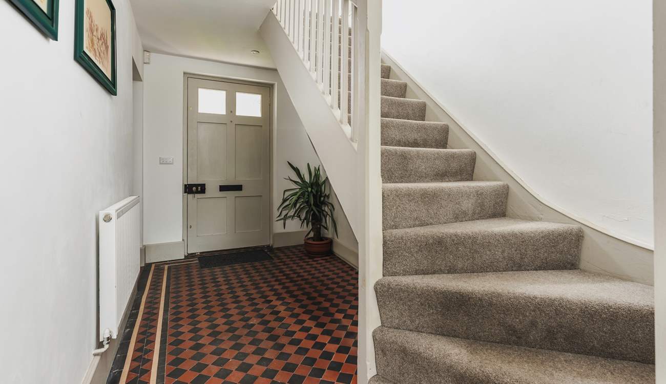The traditional front entrance hall. The stairs lead to three of the four bedrooms.