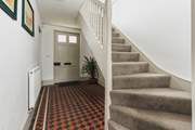 The traditional front entrance hall. The stairs lead to three of the four bedrooms.