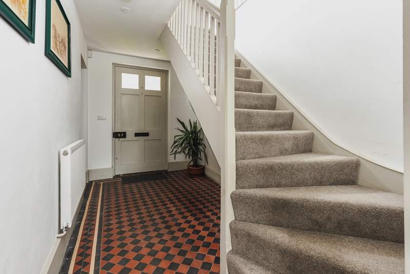 The traditional front entrance hall. The stairs lead to three of the four bedrooms.