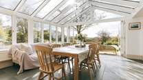 The garden-room links from the spacious kitchen and to the main sitting-room - and of course to the patio and the extensive garden. There are lovely open views to the south.