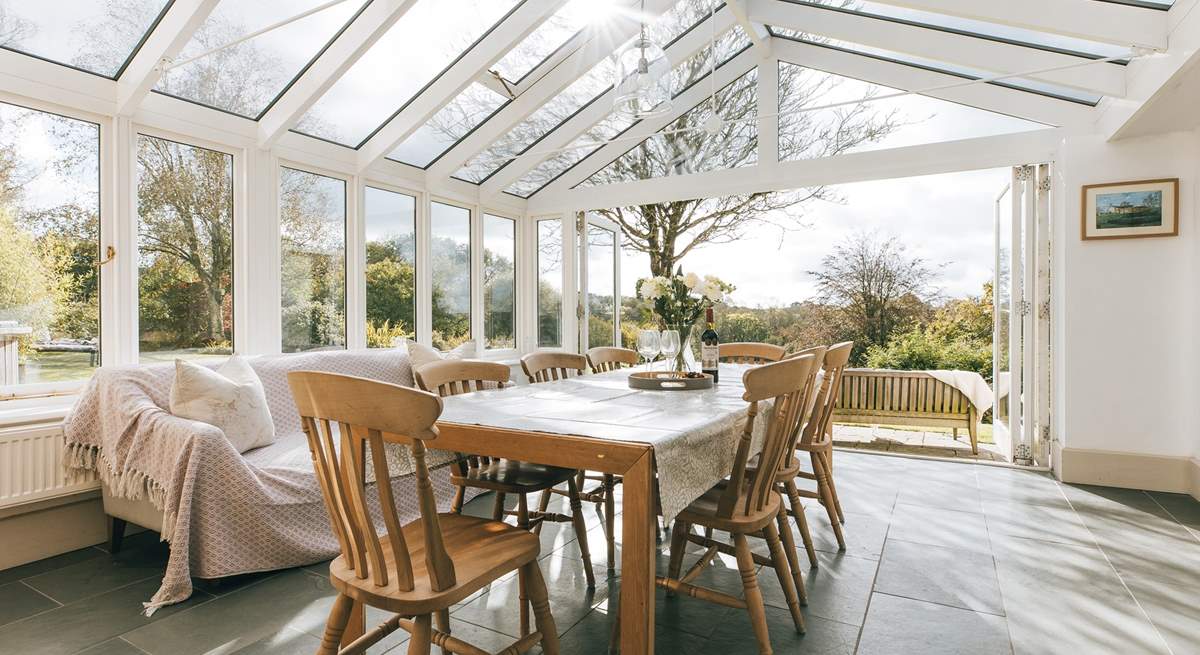 The garden-room links from the spacious kitchen and to the main sitting-room - and of course to the patio and the extensive garden. There are lovely open views to the south.