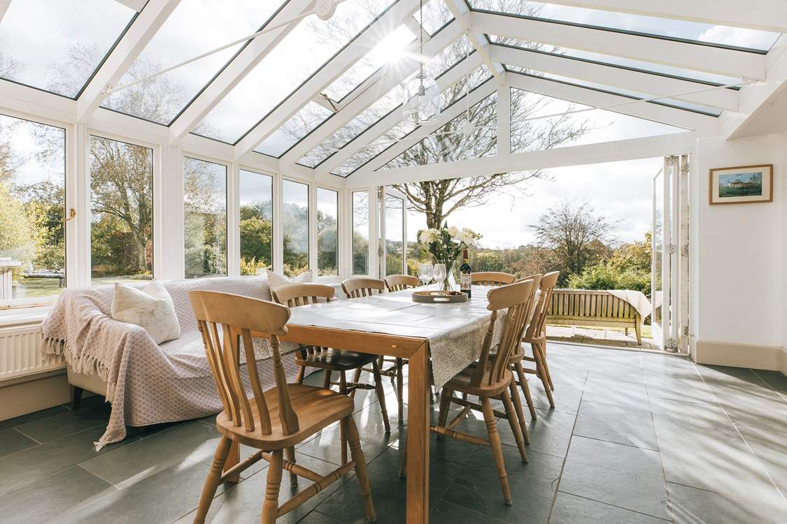 The garden-room links from the spacious kitchen and to the main sitting-room - and of course to the patio and the extensive garden. There are lovely open views to the south.