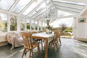 The garden-room links from the spacious kitchen and to the main sitting-room - and of course to the patio and the extensive garden. There are lovely open views to the south.