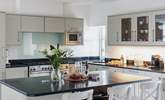 The kitchen has a large island/breakfast-bar as well as the breakfast table. - Thumbnail Image