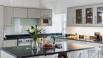 The kitchen has a large island/breakfast-bar as well as the breakfast table.
