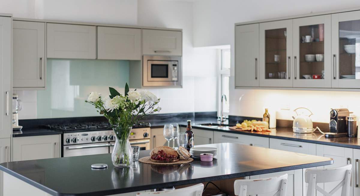 The kitchen has a large island/breakfast-bar as well as the breakfast table.