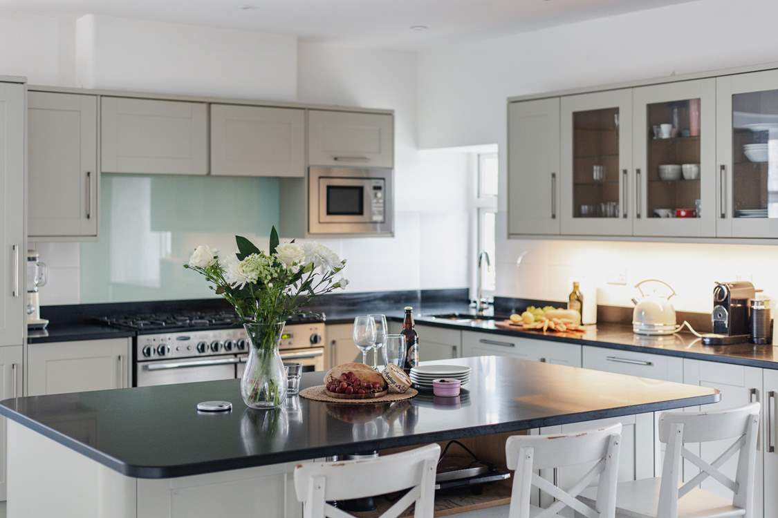 The kitchen has a large island/breakfast-bar as well as the breakfast table.
