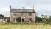 This is the front face of the farmhouse. Parking is in the courtyard behind the house and the gardens spread out to the south.