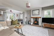 This is the gracious main sitting-room. Double doors lead into the garden-room.