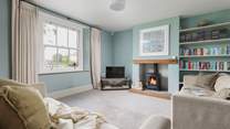 This is the tranquil snug which also has a wood-burning stove. This room links directly to the kitchen and the front hall.