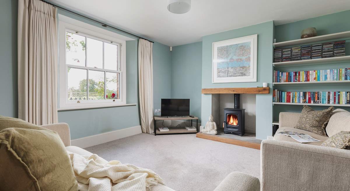 This is the tranquil snug which also has a wood-burning stove. This room links directly to the kitchen and the front hall.