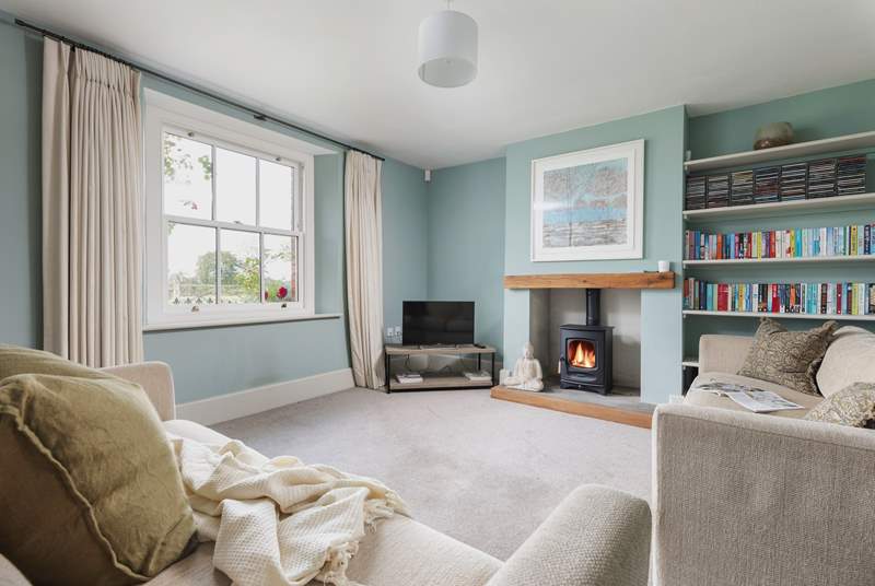 This is the tranquil snug which also has a wood-burning stove. This room links directly to the kitchen and the front hall.