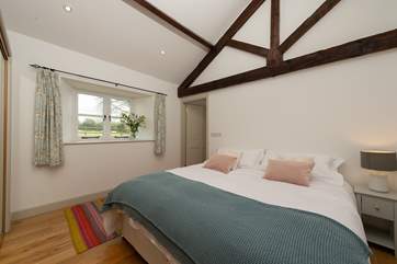 This bedroom can be set up as a super-king double or as twin beds. It looks out over the cottage's own garden and to the field beyond.