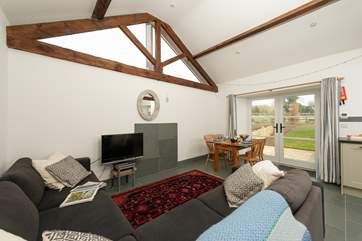 The cottage has an open plan kitchen/dining/living area with wonderful high ceilings and flagstone floors.