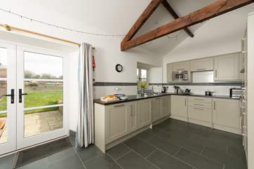 There is a really well-equipped fitted kitchen. French doors take you out onto your patio and to your own private garden overlooking fields.