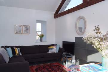 The cottage has an open plan kitchen/dining/living area with wonderful high ceilings and flagstone floors.