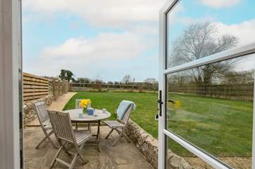 Doors from the sitting-room open out to your private, enclosed patio and garden.
