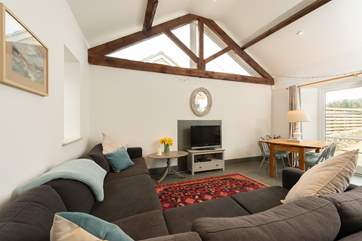 The cottage has an open plan kitchen/dining/living area with wonderful high ceilings and flagstone floors.