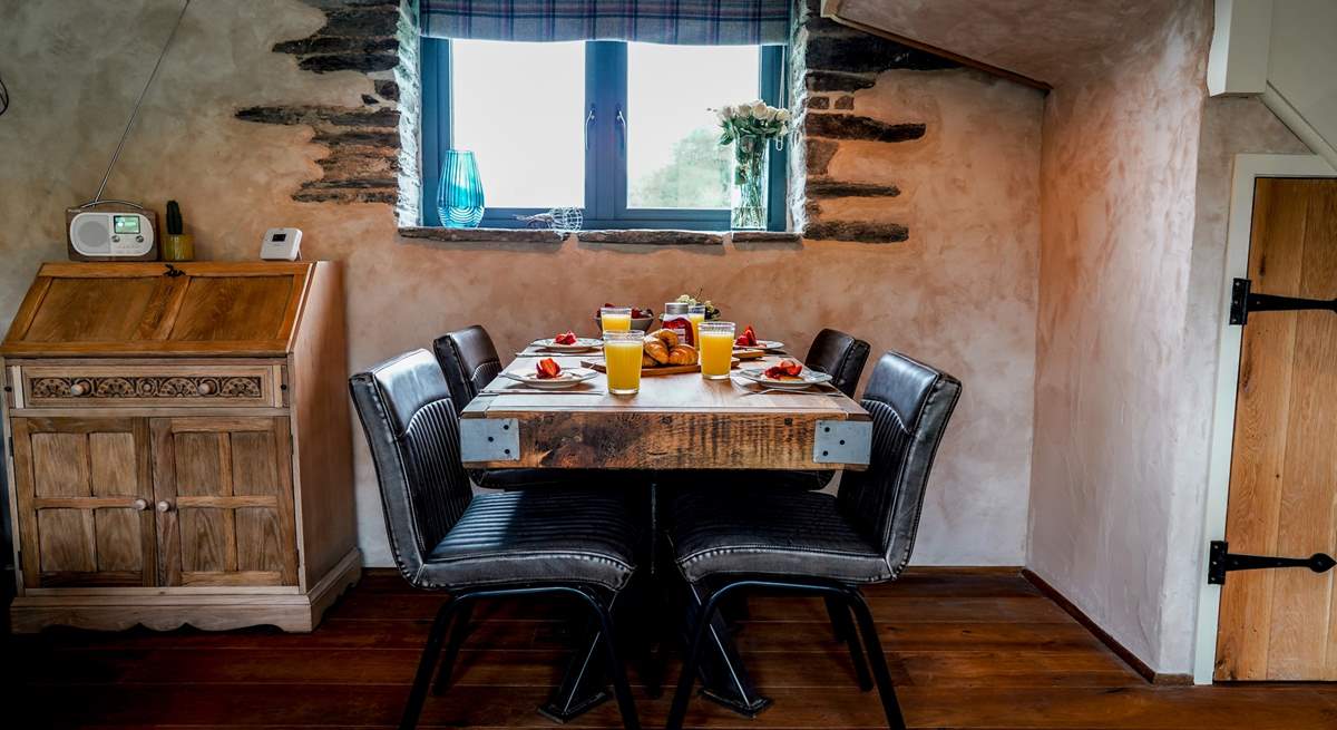 A perfectly positioned dining-table on the ground floor, situated between the kitchen and sitting-area. 