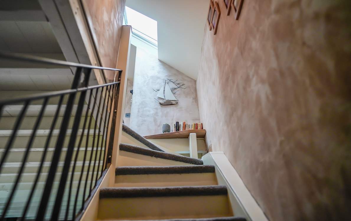 The stairs have fixed stair-gates at both the top and bottom.