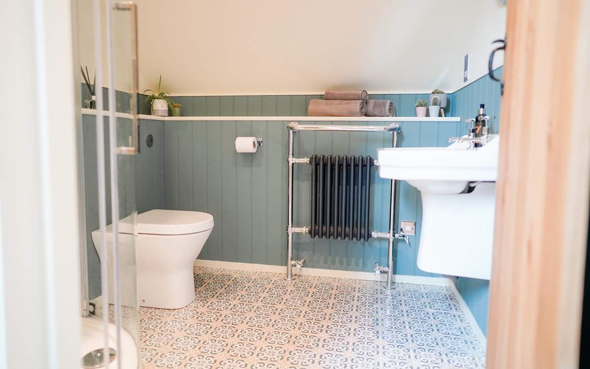 The shower-room is situated between the two bedrooms, with a heated towel rail and waterfall shower there will be no cold mornings.