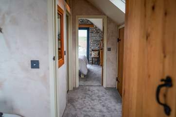 The landing which links the two bedrooms, separated by the shower-room.