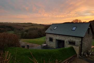 A sunrise view from the field above the barn, the grass bank at over six foot tall gives you total privacy from the owners. In no way is your privacy compromised.