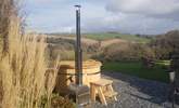 Enjoy the wonderful wood fired hot tub whilst soaking in the view across the valley! - Thumbnail Image