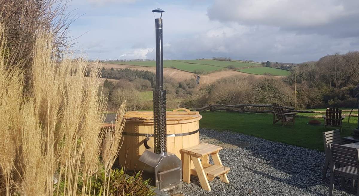 Enjoy the wonderful wood fired hot tub whilst soaking in the view across the valley!