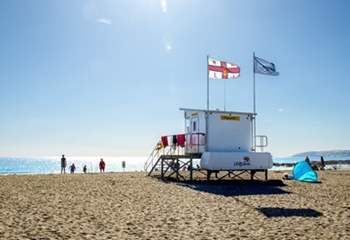 There are lifeguards on the beach  at Seaton during the peak months.