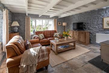 Relax and unwind in this glorious sitting-room.