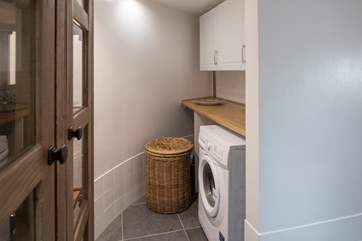 Just off the kitchen you have this handy utility-room.