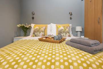 The super comfy double bed has lovely linens and soft towels.
