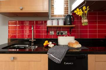 The kitchen has a single ring hob, perfect for light suppers.