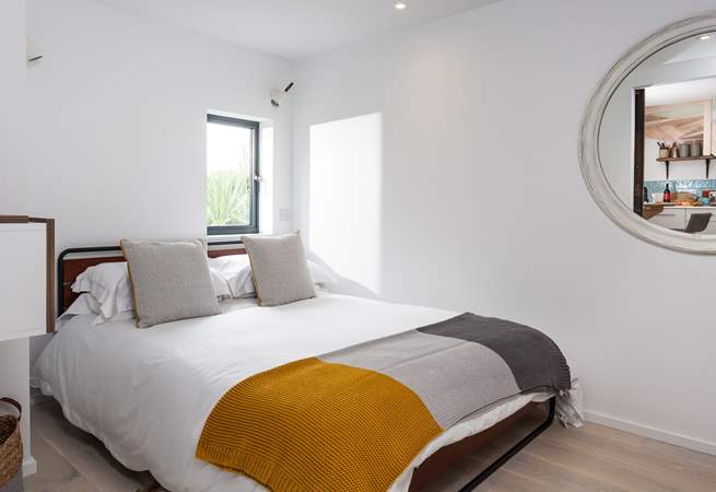 The comfortable ground floor bedroom with its king-size bed.