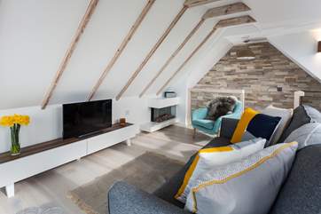 A contemporary fire keeps you warm and cosy.
