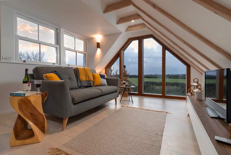 A contemporary first floor sitting-room, with beautiful views. 